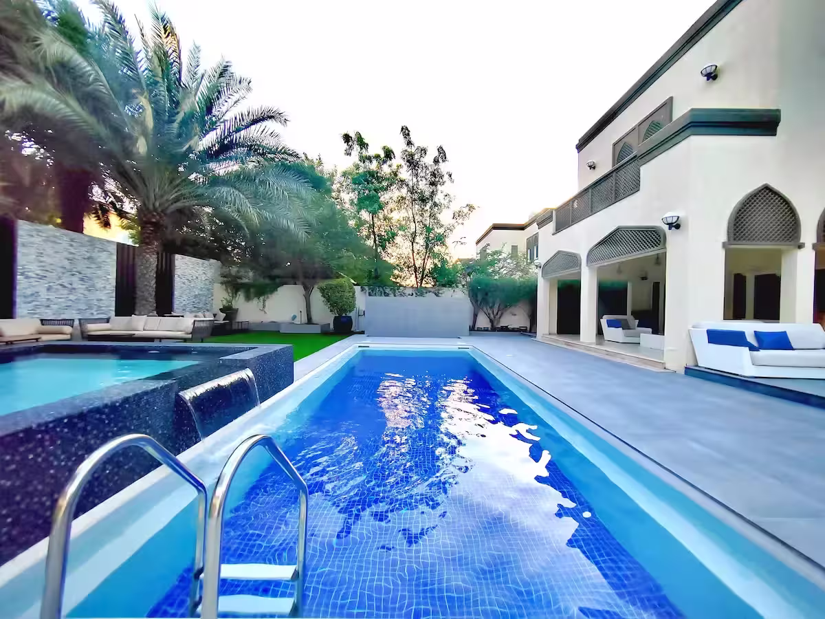 Luxury Dubai villa with pristine pool and palm trees